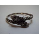 A silver coloured metal snake bangle, set marcasite,
