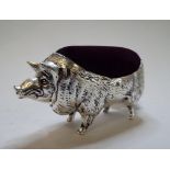 A plated pig pincushion,