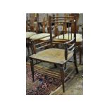 An Arts & Crafts style armchair Condition report chair has had repairs to splits,