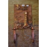 A copper two light wall sconce, the back decorated a lighthouse, 23.