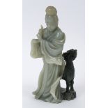 A Chinese green hardstone figure, of a figure and a Dog of Fo, damages,