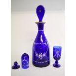 A blue glass decanter and stopper, with enamel and gilt decoration, 34.