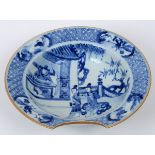 A Chinese porcelain barber's bowl, decorated figures in underglaze blue,
