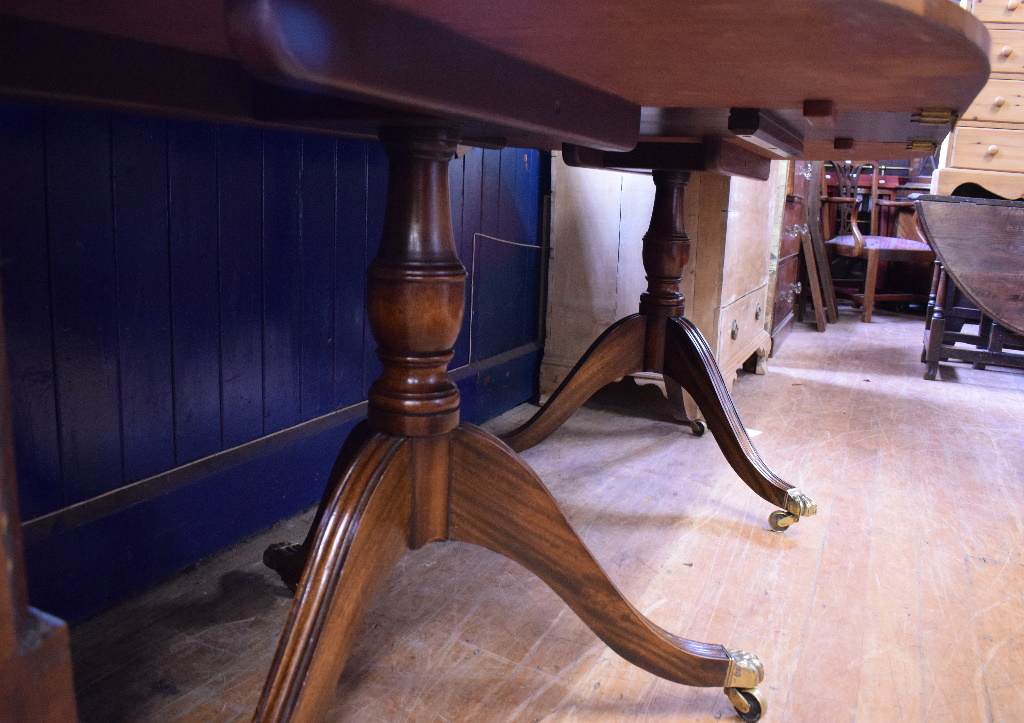A Regency style inlaid mahogany twin pillar dining table, inset an extra leaf, - Image 4 of 4