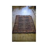 A Persian rug, with stylised motifs, on a blue ground, within a multi border,