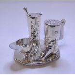 A plated condiment set, in the form of a jockey cap,
