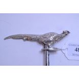 A corkscrew, with a silver handle, in the form of a pheasant,