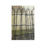 A set of five painted metal garden frames, for plants,