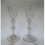 A pair of Jacobite type ale glasses, the bowls etched with Scottish thistles and English roses,