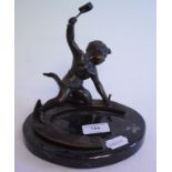 A bronze figure, in the form of a putto hammering a nail into a horseshoe, on a marble base, 17.