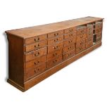 A large pine shop counter, one side panelled,