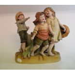 A bisque group, of three children, restored,