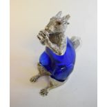 A blue glass decanter, in the form of a squirrel, with plated mounts,