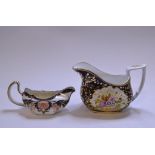 An English porcelain sauce boat, with Imari style decoration, a similar milk jug, painted flowers,