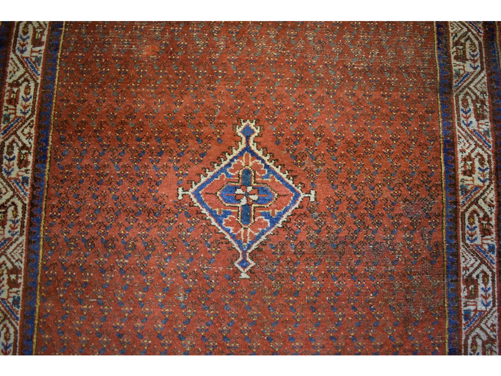 A Persian rug, decorated motifs on a pin - Image 4 of 4