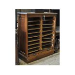 An early 20th century oak filing cabinet