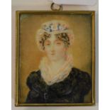A bust portrait miniature, of a lady wea