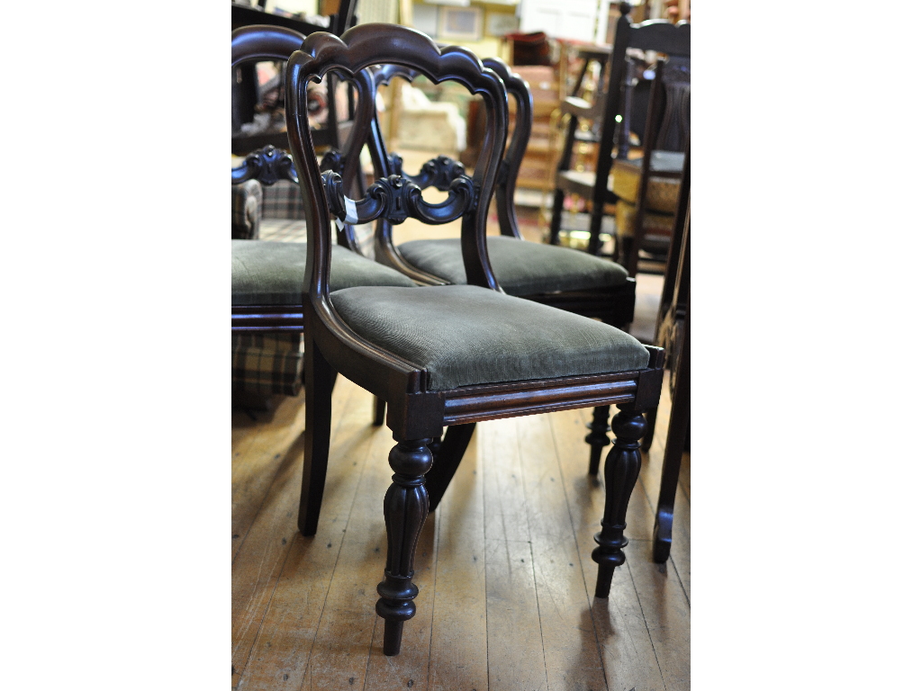 A set of four Victorian rosewood dining