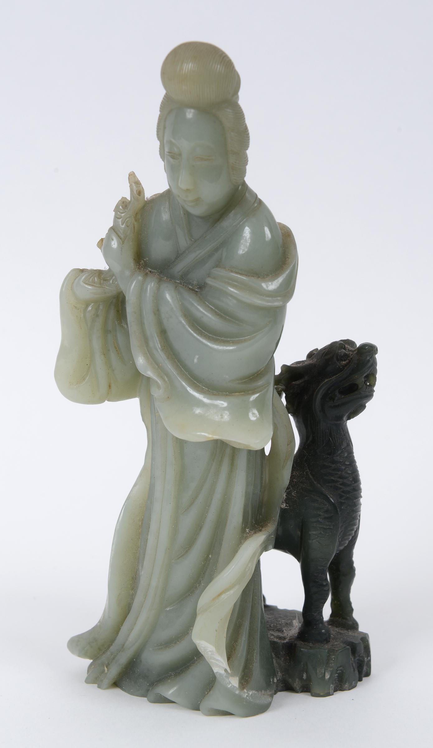 A Chinese green hardstone figure, of a f