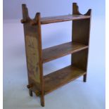 A set of pine painted wall shelves, with