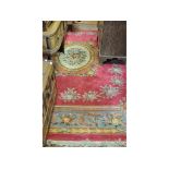 A large Chinese rug, decorated a central