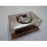 A silver matchbox holder, later applied