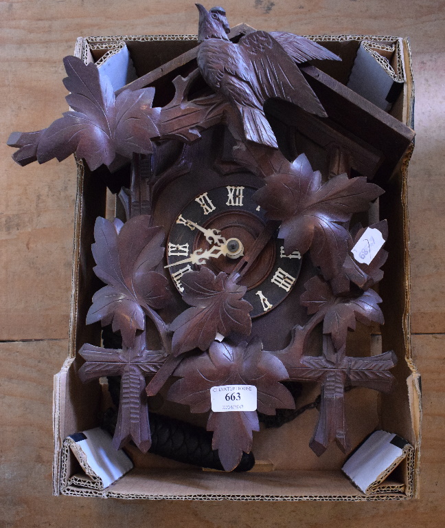 A Black Forest style carved wood cuckoo