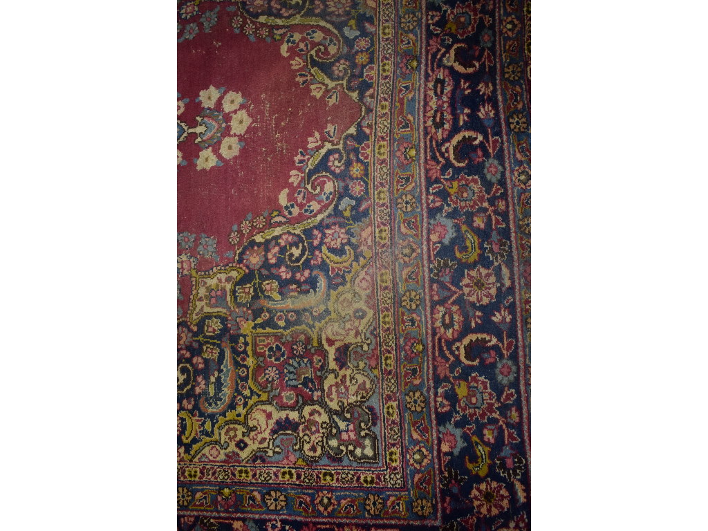 A Persian carpet, decorated a central lo - Image 3 of 5