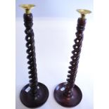 A pair of barley twist candlesticks, 53.