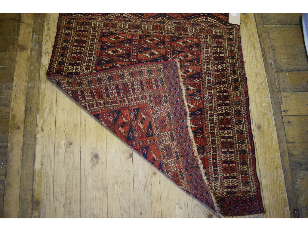 A Turkoman rug, decorated geometric shap - Image 2 of 3