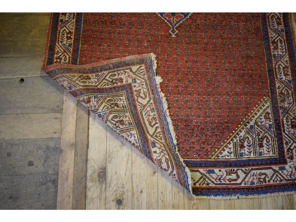 A Persian rug, decorated motifs on a pin - Image 2 of 4