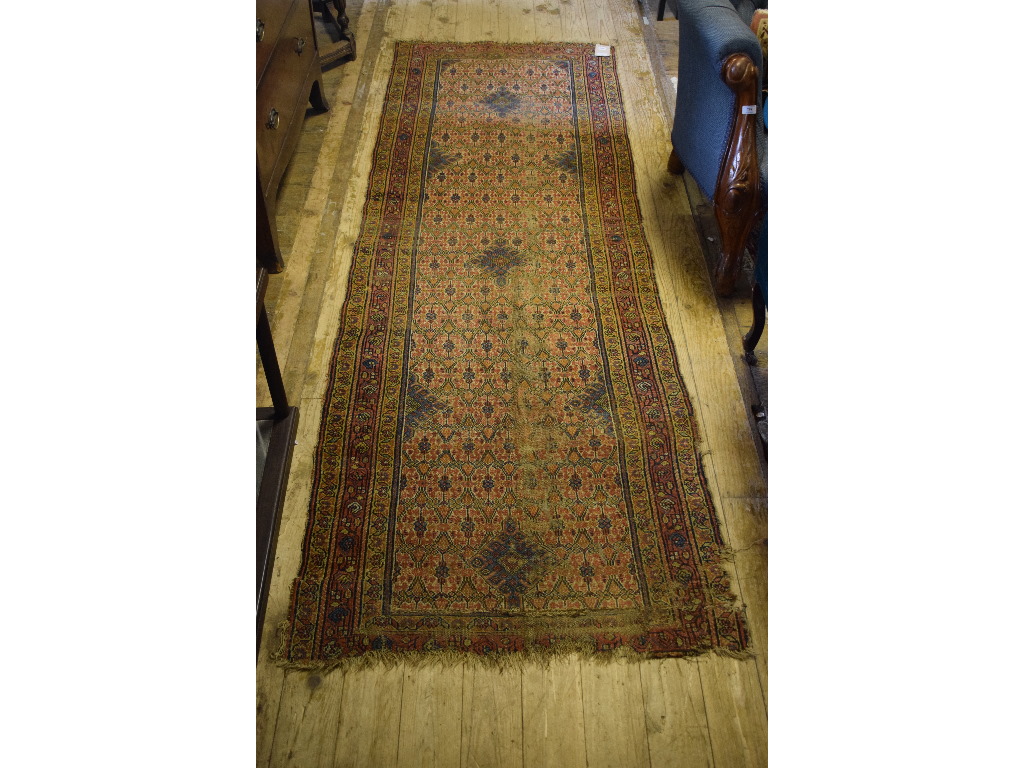 A Persian runner, with stylised floral m