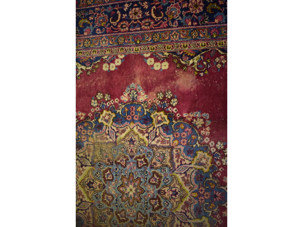 A Persian carpet, decorated a central lo - Image 4 of 5