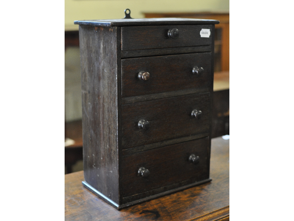 A tabletop chest, of four graduated long