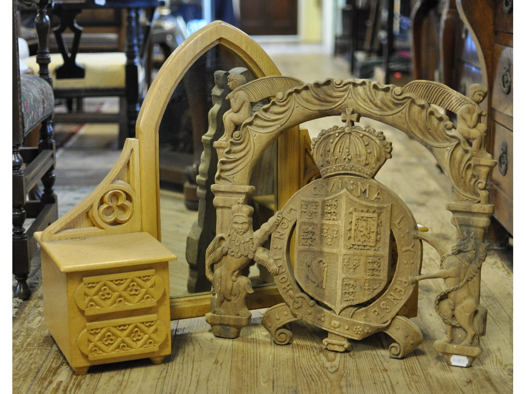A carved coat of arms, 55 cm wide, and a