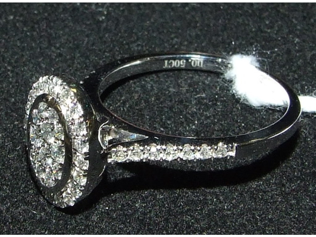 A 9ct white gold and oval diamond cluste - Image 2 of 3