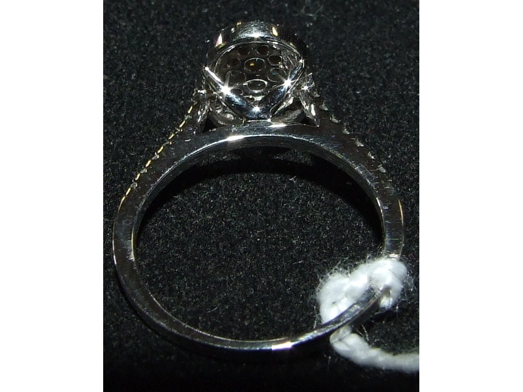A 9ct white gold and oval diamond cluste - Image 3 of 3