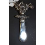 A silver baby's rattle, in the form of a