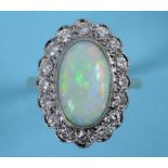 A gold ring, the central oval opal withi