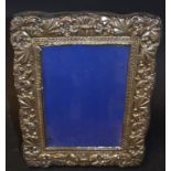 A silver mounted photograph frame, an Isle of Wight glass paperweight, other paperweights,