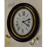 A Must de Cartier oval strut clock, one