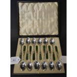 A set of twelve silver and jade coffee s