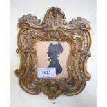 A 19th century bronze tinted silhouette,