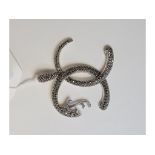 A silver coloured metal snake bangle, se