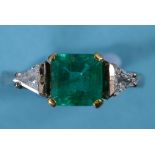 An 18ct gold, emerald and diamond ring,