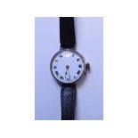 A lady's silver wristwatch, the enamel dial with Roman numerals, cracked, and a tie press,