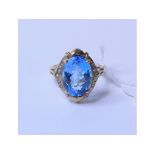 A 9ct gold, blue topaz and diamond ring,