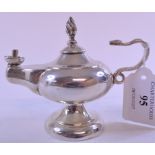 A silver oil lamp, with a serpent handle