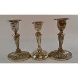 A pair of Victorian silver candlesticks, on spreading oval bases, Sheffield 1897, 16.