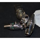 A silver coloured metal whistle, in the